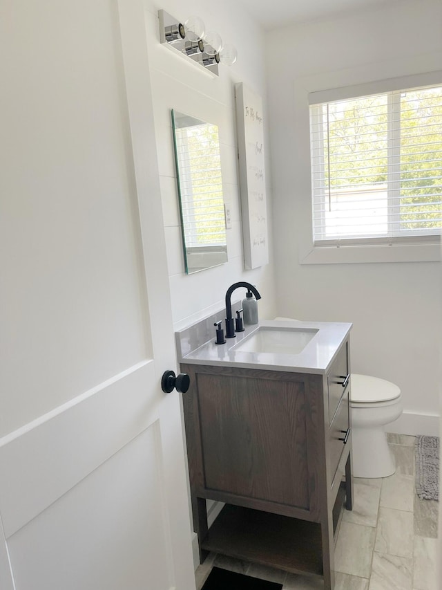 bathroom with vanity and toilet