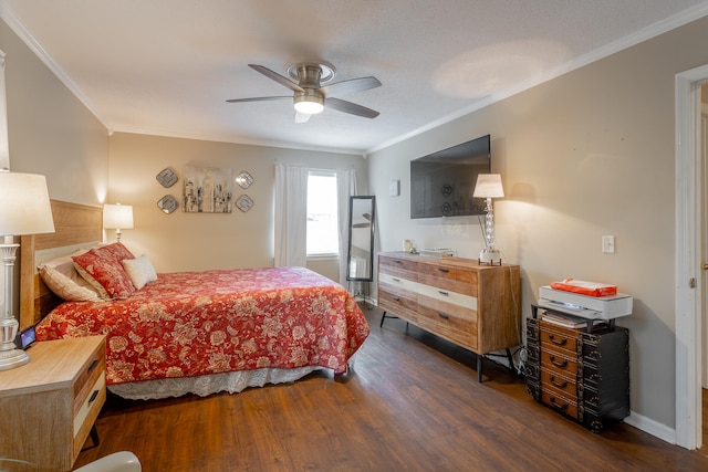 bedroom with ornamental molding, ceiling fan, and dark hardwood / wood-style floors