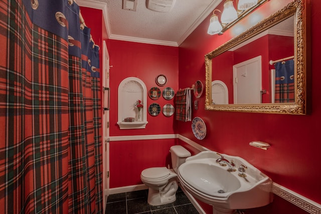 bathroom with ornamental molding, sink, a textured ceiling, tile patterned floors, and toilet