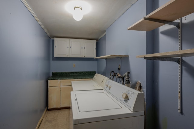 laundry room with ornamental molding and washer and dryer