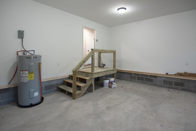 basement featuring electric water heater