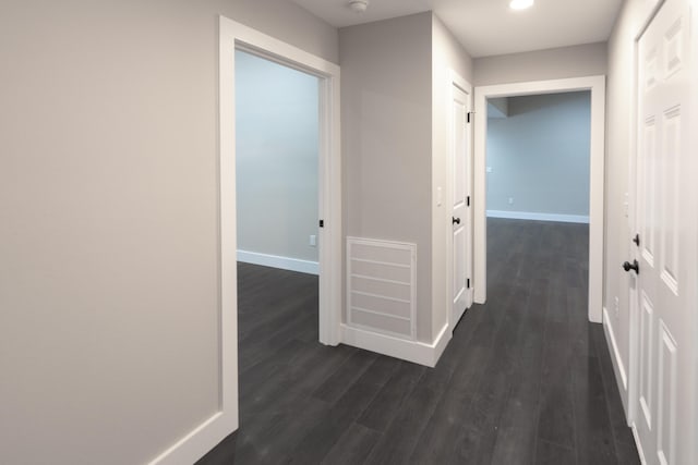 hall with dark wood-type flooring