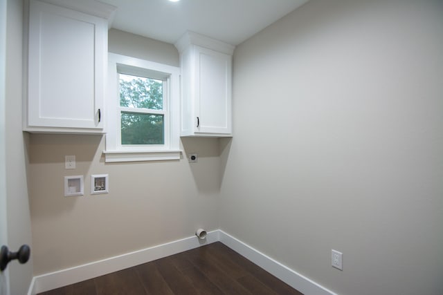 laundry area with cabinets, dark wood-type flooring, hookup for a washing machine, and hookup for an electric dryer