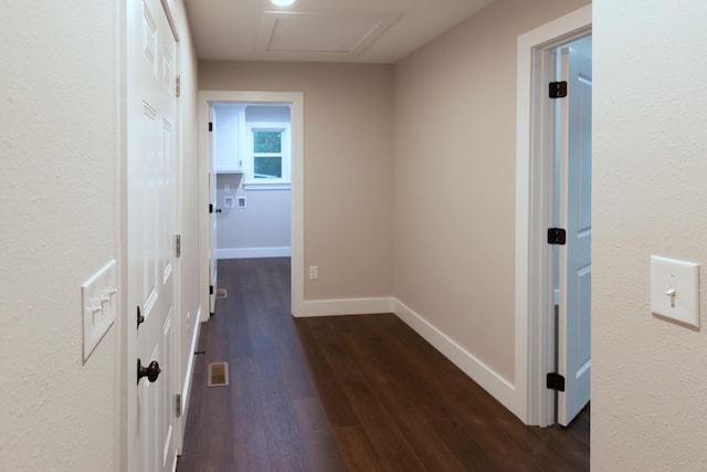 hallway featuring dark hardwood / wood-style flooring