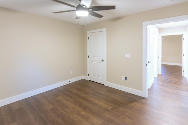 unfurnished room featuring ceiling fan and dark hardwood / wood-style floors