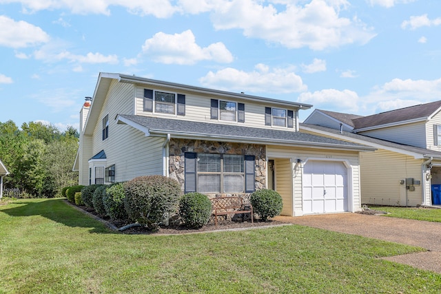 view of front facade with a front yard and a garage