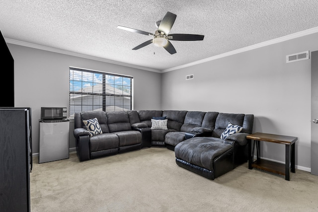 living room featuring light carpet, a textured ceiling, crown molding, and ceiling fan