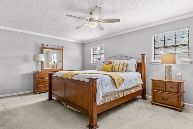 carpeted bedroom with ceiling fan, a textured ceiling, and ornamental molding