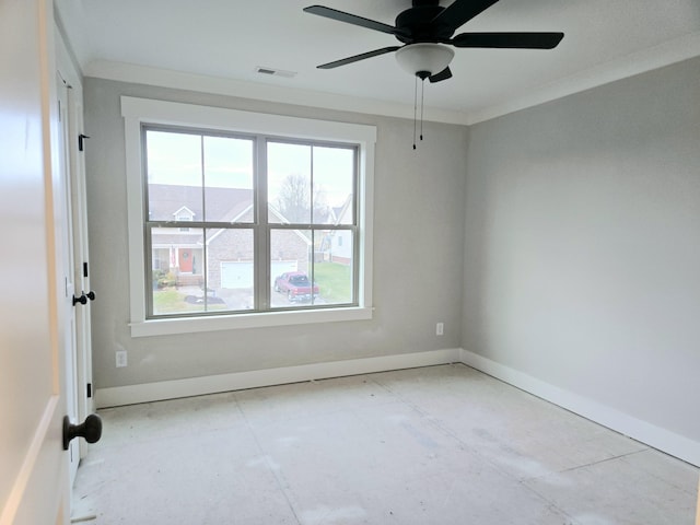 unfurnished room with visible vents, baseboards, ceiling fan, and crown molding