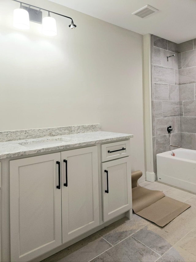 full bath with shower / tub combination, visible vents, and vanity