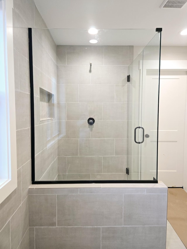 full bathroom with a shower stall, visible vents, and recessed lighting