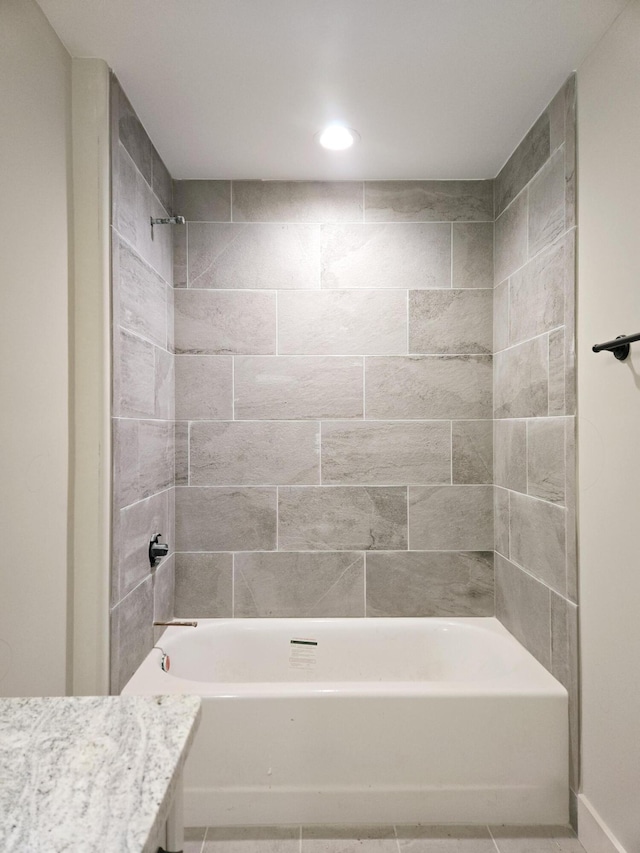 bathroom with vanity and shower / tub combination