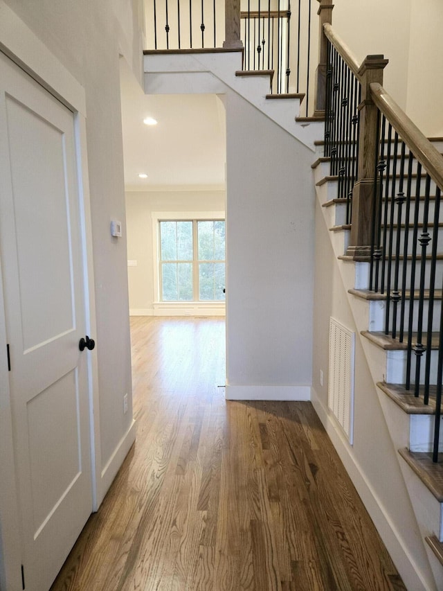 interior space with recessed lighting, visible vents, baseboards, and wood finished floors