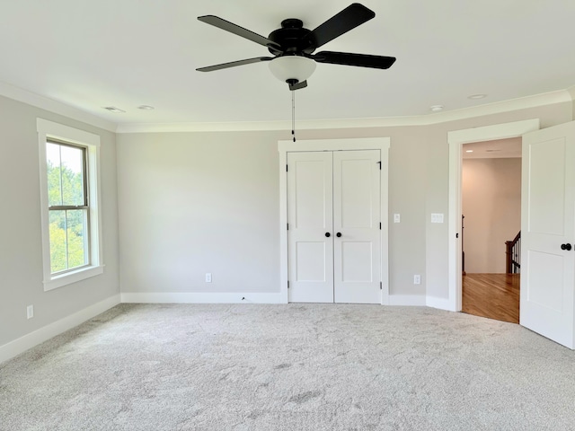269 Quartz Dr Unit 21, Chickamauga, GA 30707 - unfurnished bedroom featuring crown molding, carpet flooring, baseboards, a closet, and a ceiling fan