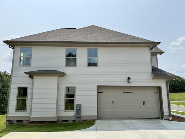 269 Quartz Dr Unit 21, Chickamauga, GA 30707 - back of house with an attached garage, driveway, and a shingled roof