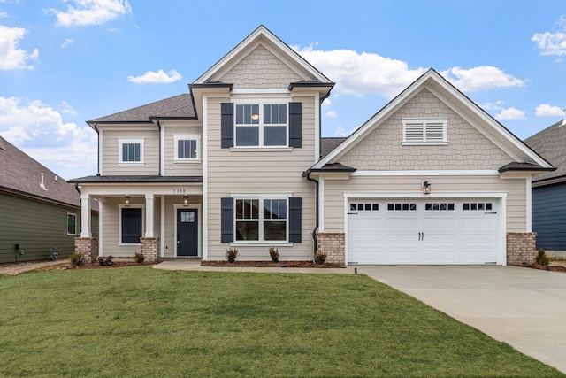 craftsman house featuring a garage and a front yard