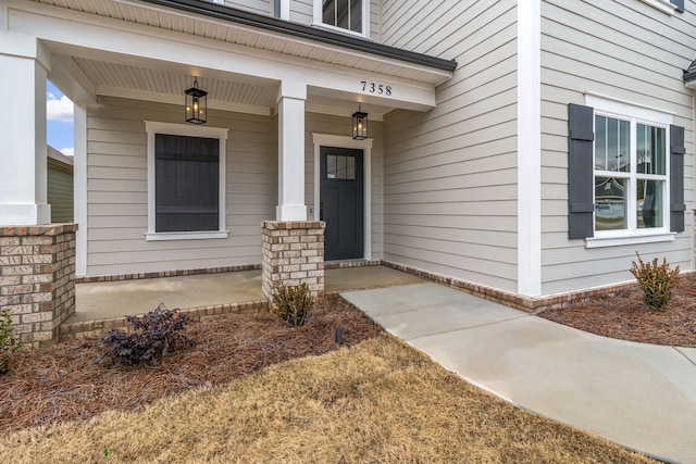 doorway to property featuring a porch