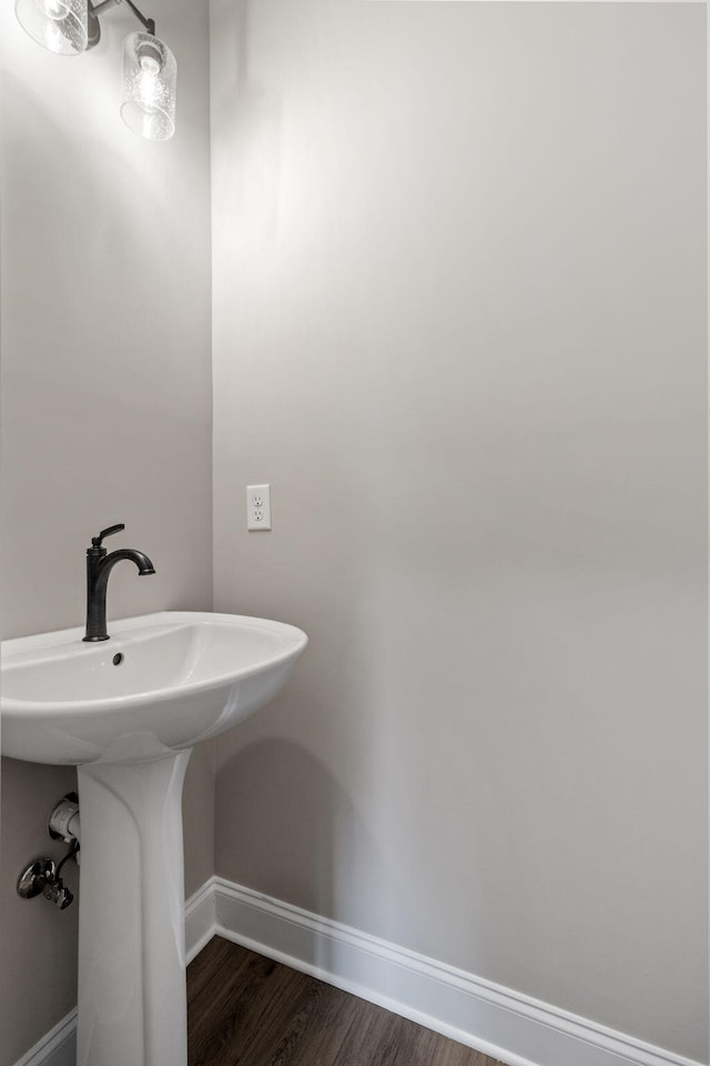 bathroom with hardwood / wood-style flooring