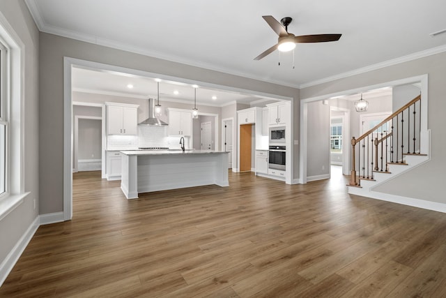 unfurnished living room with sink, dark wood-type flooring, and ornamental molding