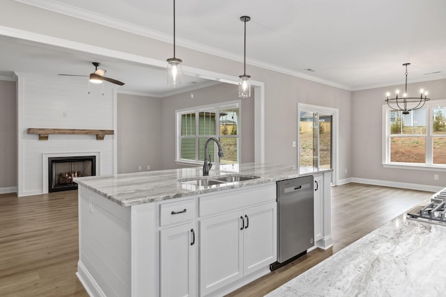 kitchen featuring hardwood / wood-style floors, dishwasher, white cabinetry, sink, and decorative light fixtures