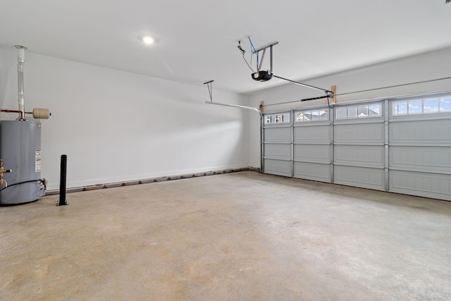 garage featuring gas water heater and a garage door opener