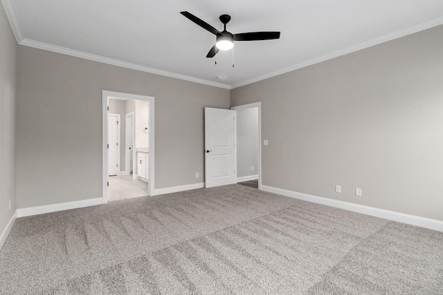 unfurnished bedroom featuring ceiling fan, light colored carpet, connected bathroom, and crown molding