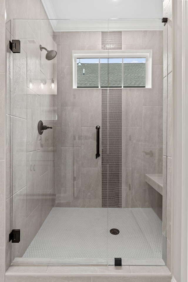 bathroom featuring crown molding and walk in shower