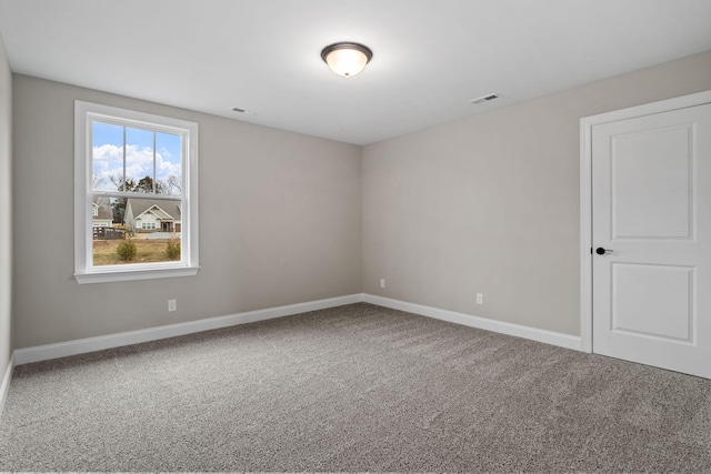 unfurnished room featuring carpet flooring