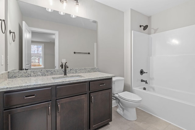 full bathroom featuring vanity, toilet, tile patterned flooring, and shower / bathing tub combination