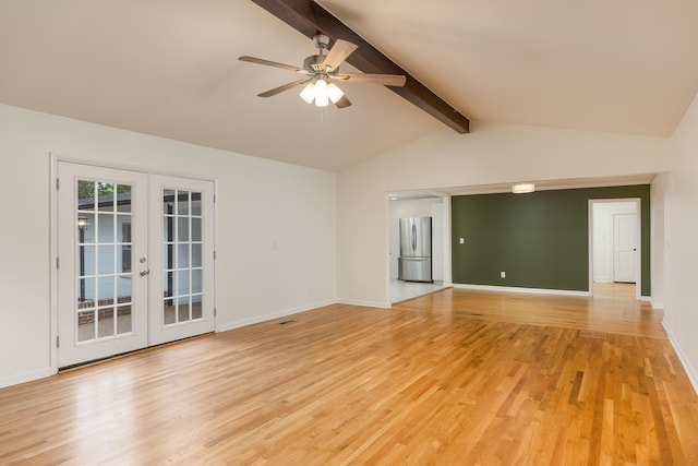 empty room with french doors, vaulted ceiling with beams, and light wood-type flooring