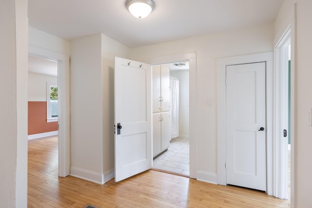 hall featuring light hardwood / wood-style flooring