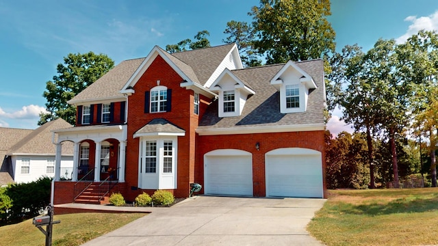 view of front facade featuring a front yard and a garage