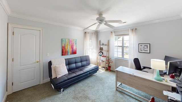 home office with carpet, ceiling fan, and crown molding