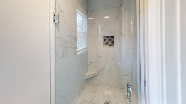 bathroom with tiled shower