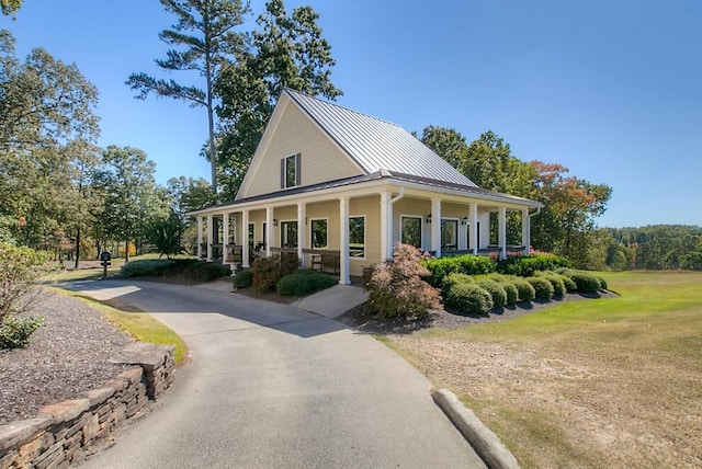 view of property exterior featuring covered porch