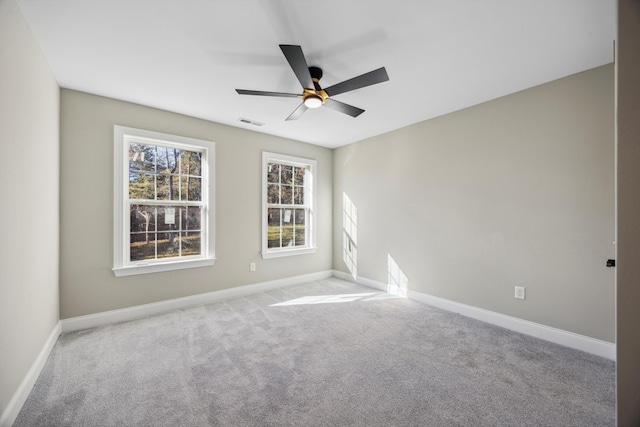 empty room with light carpet and ceiling fan