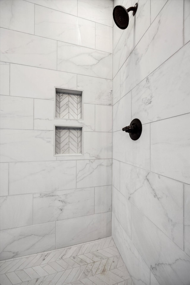 bathroom with a tile shower