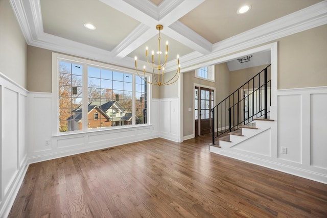 unfurnished dining area with coffered ceiling, crown molding, and beam ceiling