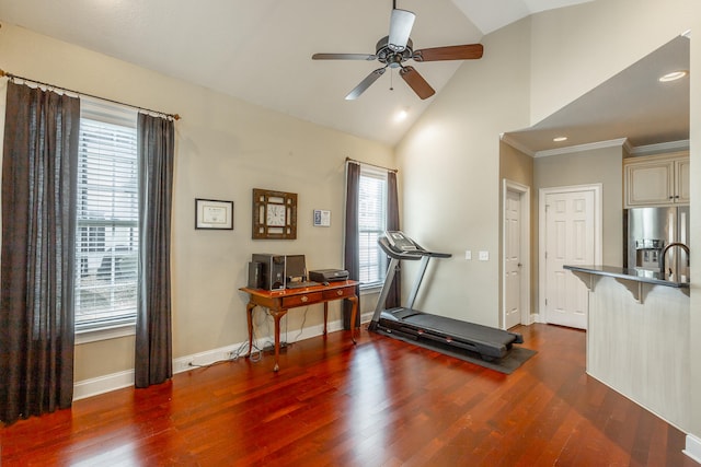 workout area with dark hardwood / wood-style floors, ceiling fan, and plenty of natural light