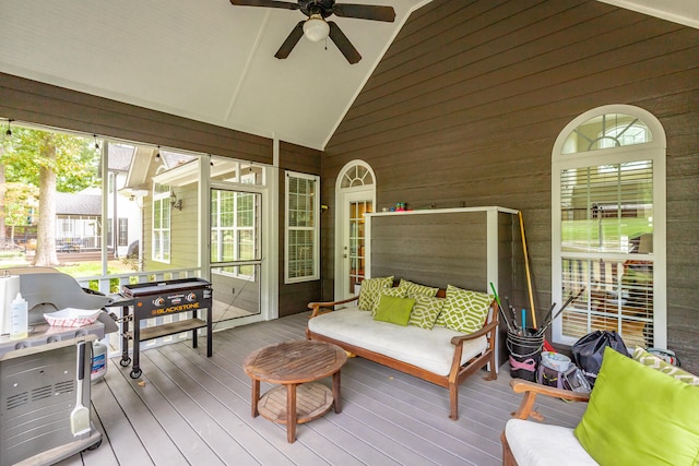 sunroom / solarium featuring vaulted ceiling and ceiling fan