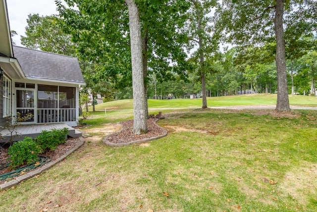 view of yard with a sunroom