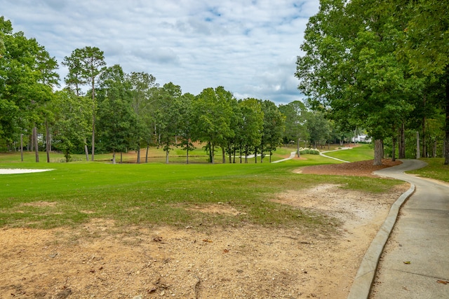 view of home's community featuring a yard