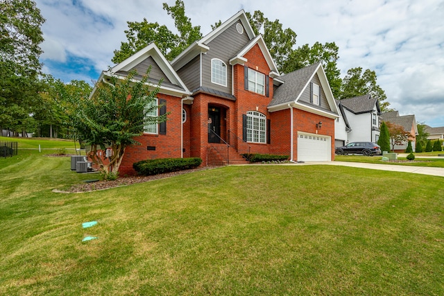 view of front facade featuring a garage, a front lawn, and central AC