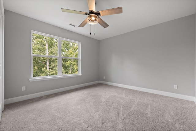 spare room with ceiling fan and carpet floors