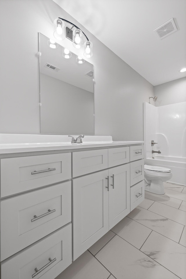 full bathroom featuring vanity, toilet, and bathtub / shower combination