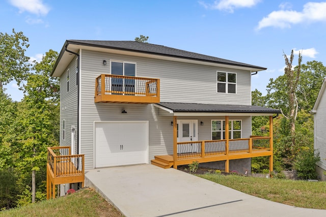 view of front of home featuring a balcony and a garage