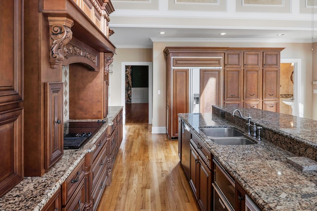 kitchen featuring ornamental molding, sink, light hardwood / wood-style flooring, dishwasher, and dark stone countertops