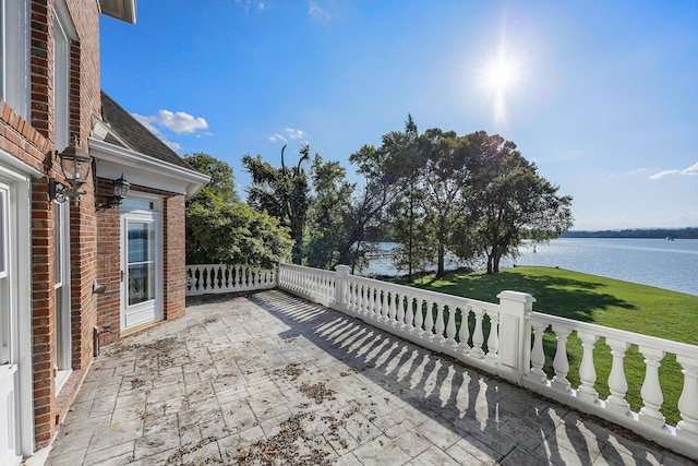 view of patio featuring a water view