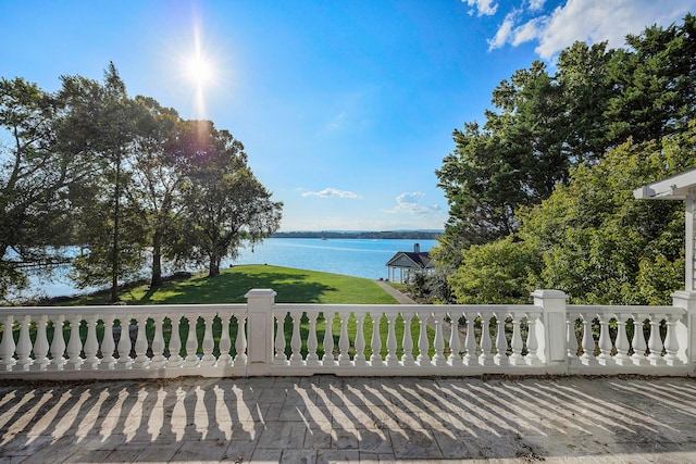 wooden terrace with a water view