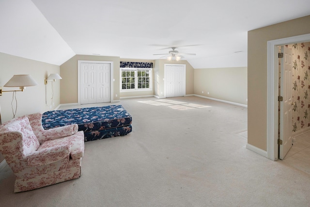 carpeted bedroom featuring vaulted ceiling and ceiling fan